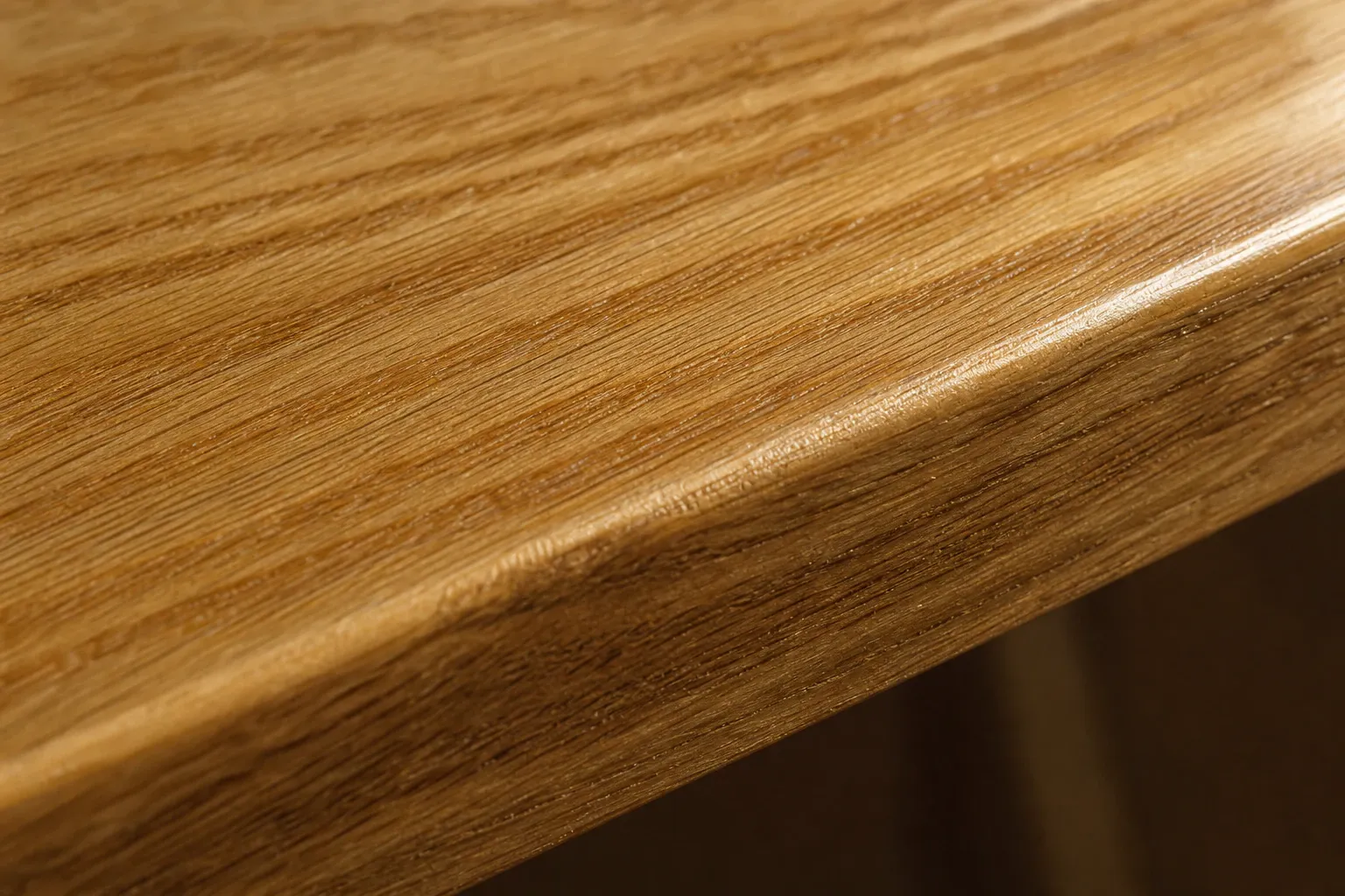 Oiled solid wood surface in close detail.